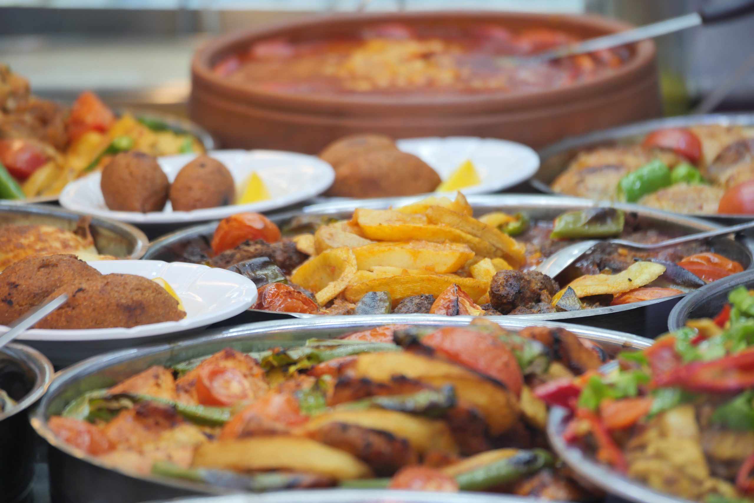 Different types of food are arranged on tables at a market.